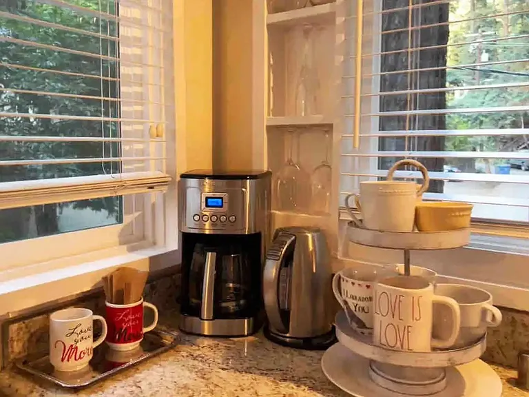 Coffee bar on granite counter top.