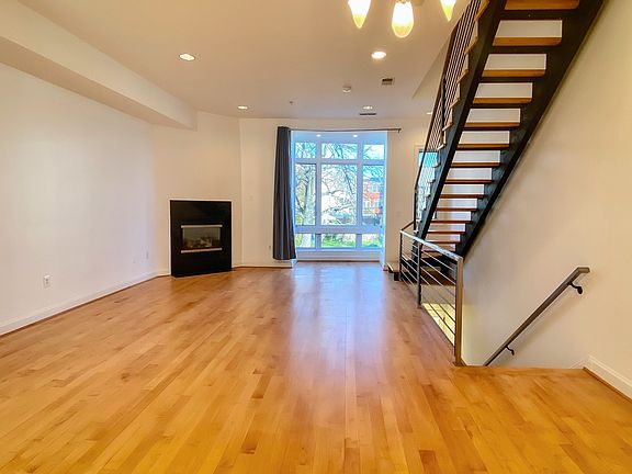 Large living room with a working gas fireplace