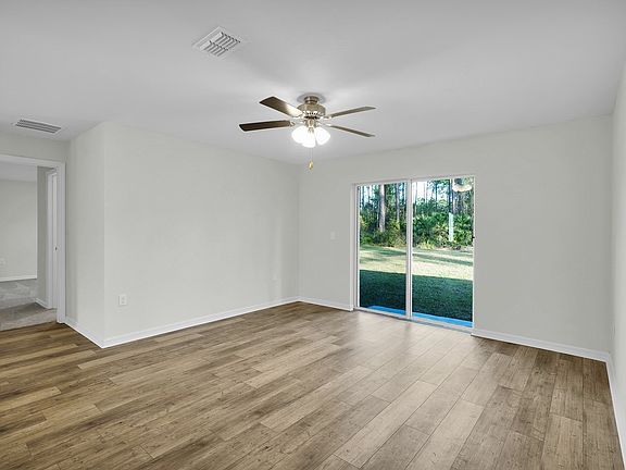 The family room s sliding doors makes it easy to enjoy the Florida weather