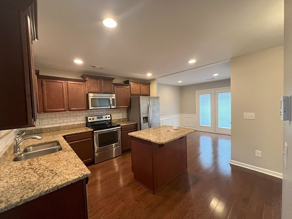 Granite counter tops w/ tiled backsplash
