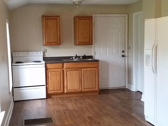View of Kitchen, additional space for storage next to the re