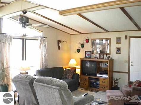 Huge trapezoid windows accent the vaulted ceilings in the main living quarters and let in tons of natural light.