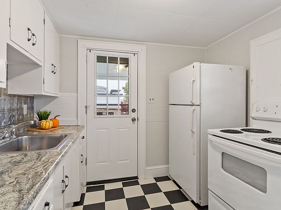 Kitchen with access to exterior deck.