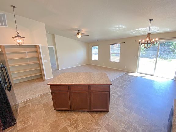 Kitchen island, Pantry closet, Living room, Dining room area