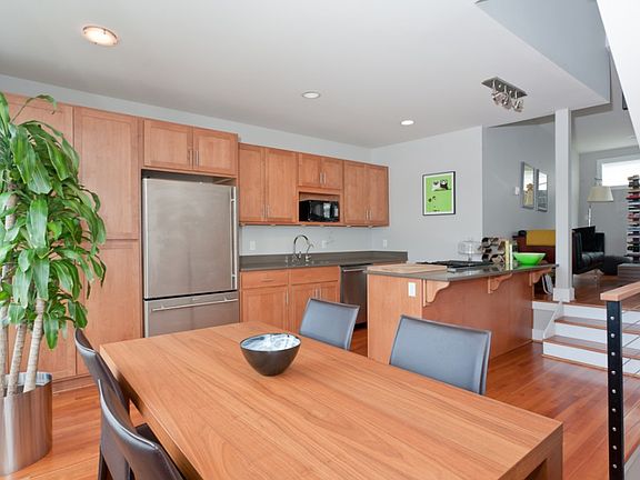 The wall of cabinets provide plenty of storage and elevate a beautiful kitchen into a highly efficie