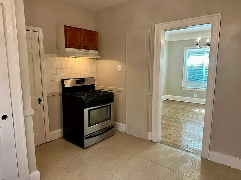 Pantry to the left of the oven; view into the dining room