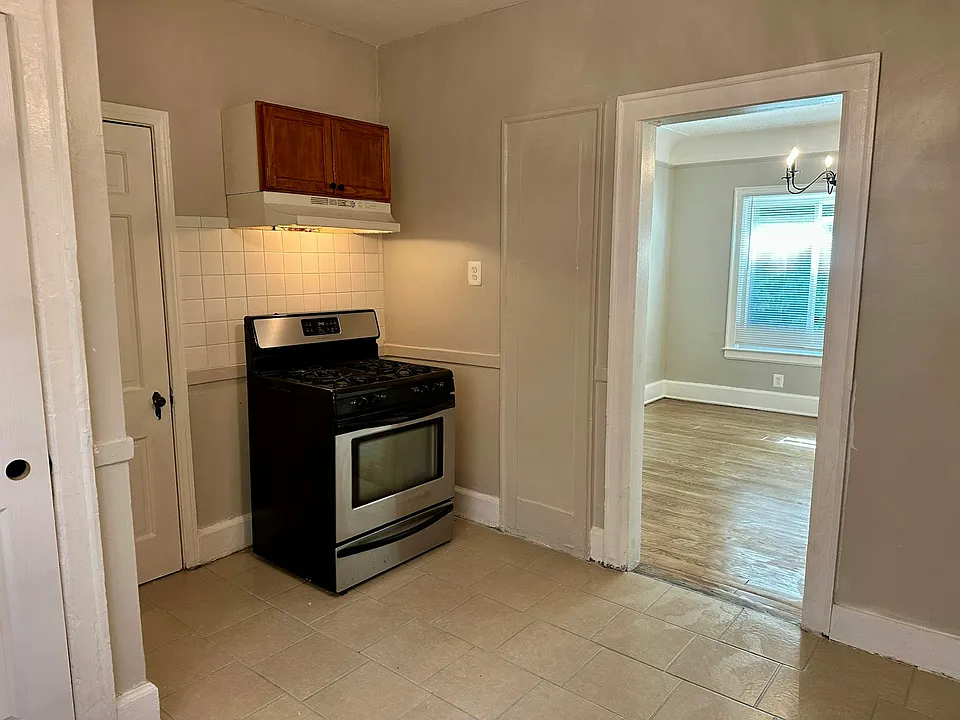 Pantry to the left of the oven; view into the dining room