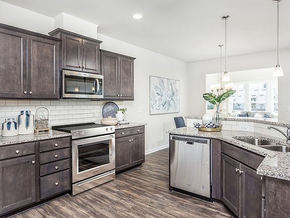 Open Kitchen with walk-in Pantry and Breakfast Bar