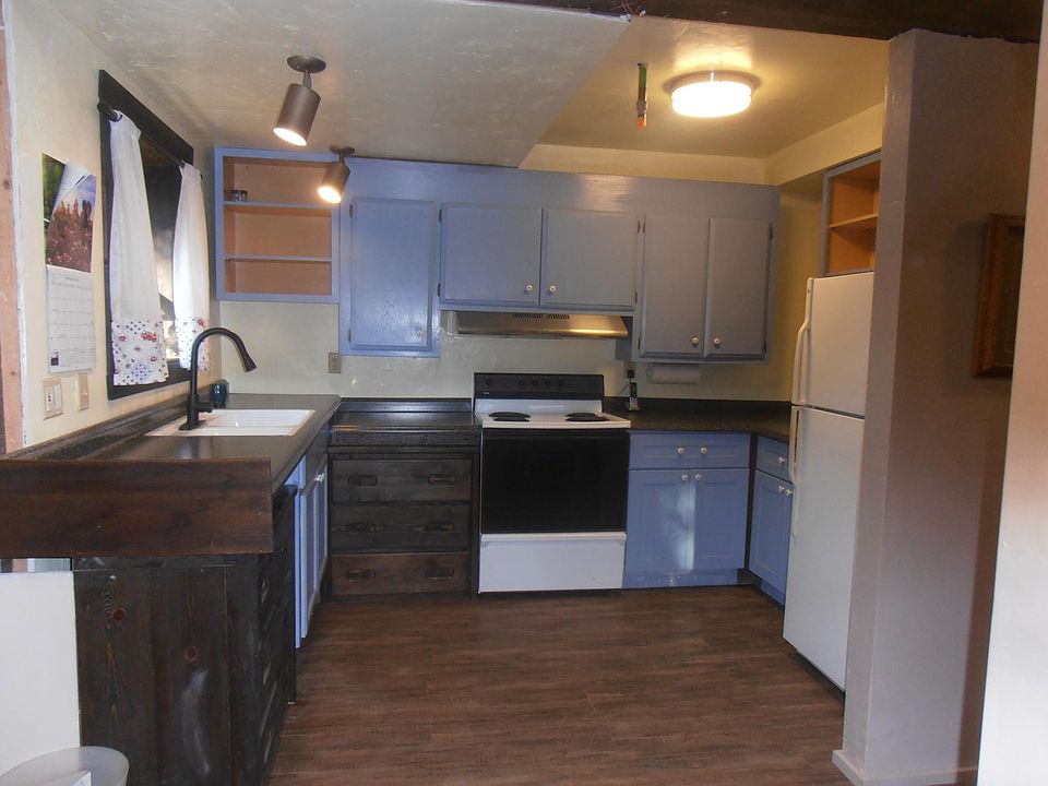 Kitchen has new floors, new granite look counters, lots of upper and lower storage. Greenhouse garden window. Lots of light.