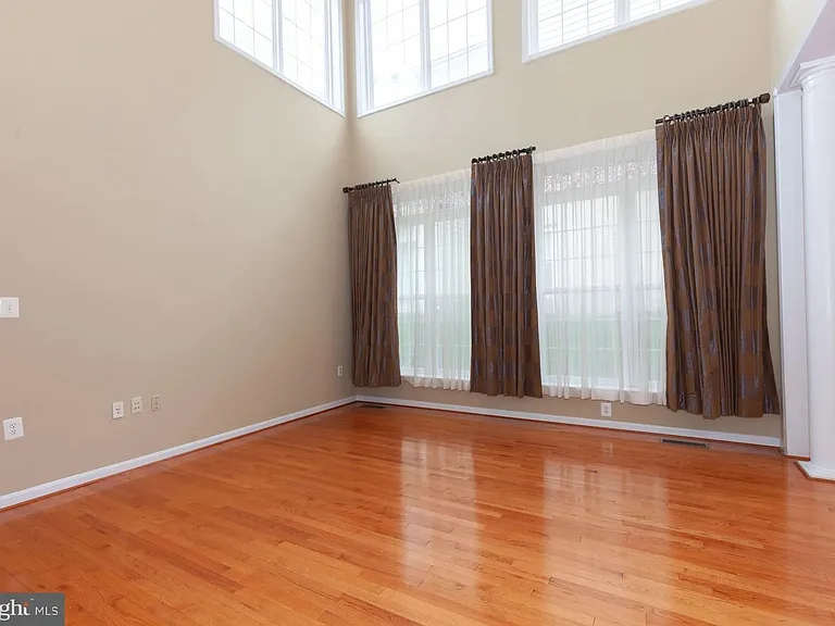 Great Room/ Family Room with 19' cathdral ceiling, lots of windows to let in natural light