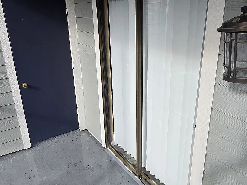Enclosed outdoor patio area with storage room