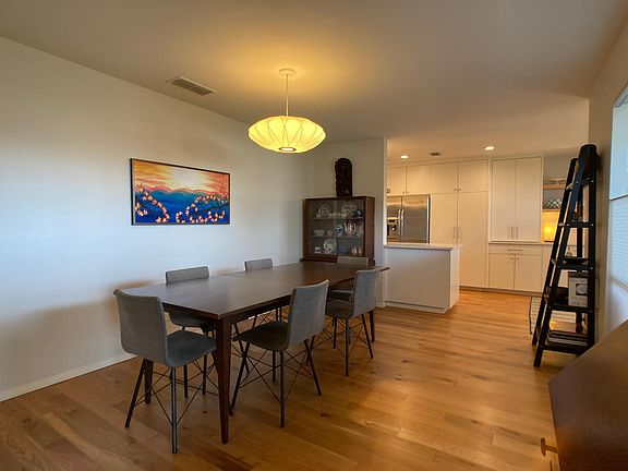 formal dining, kitchen in background