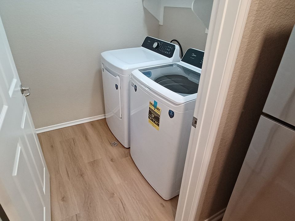 utility room brand new washer and dryer