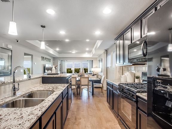 Abundant cabinet and counter space in island kitchen model representation