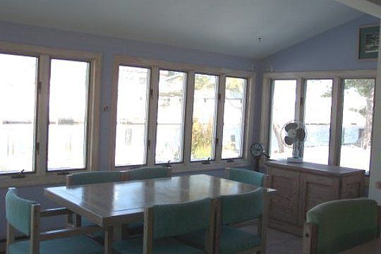 Large Table Overlook Water for Larger Gatherings and Family Time Dining