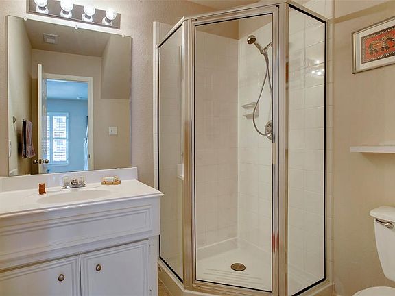 Guest bathroom with walk-in shower has been kept immaculate along with the rest of the house.