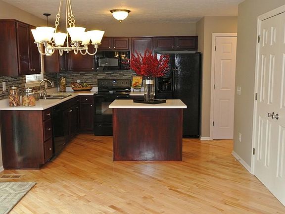 Eat-in kitchen area that leads out to the oversized deck and backyard.