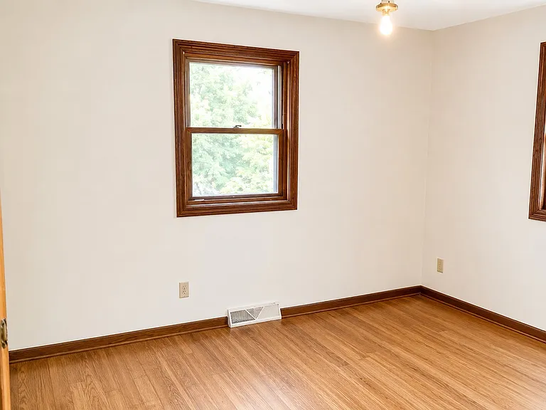 Affordable 2-bedroom, 1-bathroom single-family home for rent in Wausau featuring a garage, bright interior, yard space, and convenient access to shopping, restaurants, parks, schools, and everyday amenities.