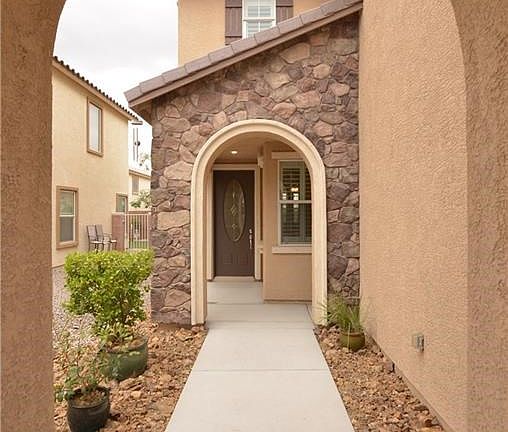 Archways leading to front entry. Custom front door.