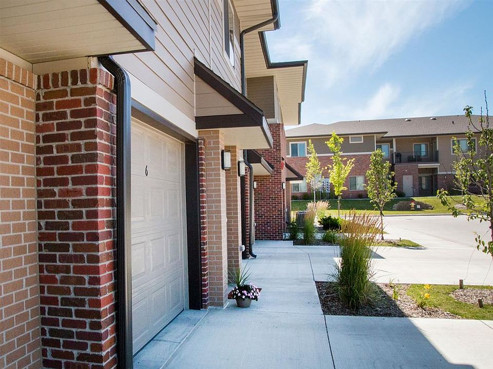 Each villa features a private entry and most include attached garages.