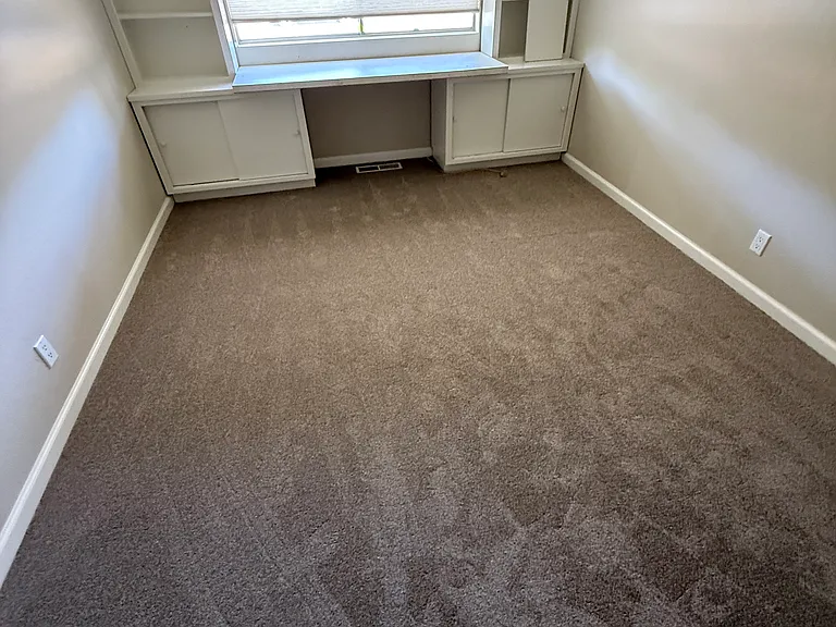 one of 4 bedrooms with built in shelves and large closet