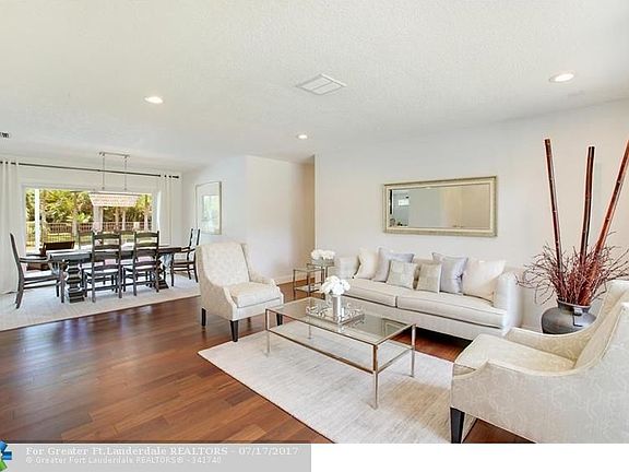 From the front Foyer you overlook the Formal Living and Dining Room with new Brazilian Hardwood Floors, Knockdown Textured walls and ceiling, High Hat Lighting, new A/C vents and expansive impact resistant windows front and back bring in the light.