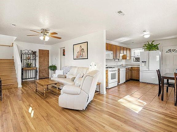 Bright, spacious kitchen, dining and living rooms open to gather for meals and entertainment.