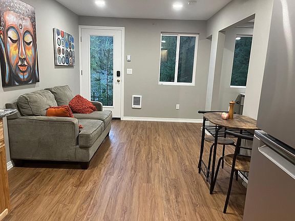 furnished living room and dining area for two.