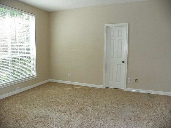 To the left, is a great study with French Doors.