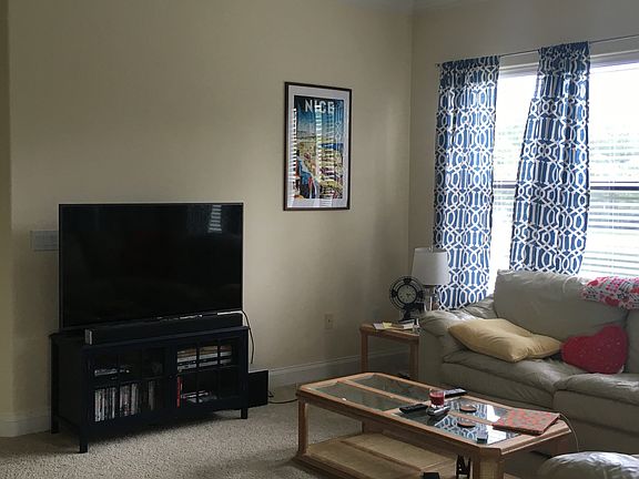 Large living room with lots of natural light.