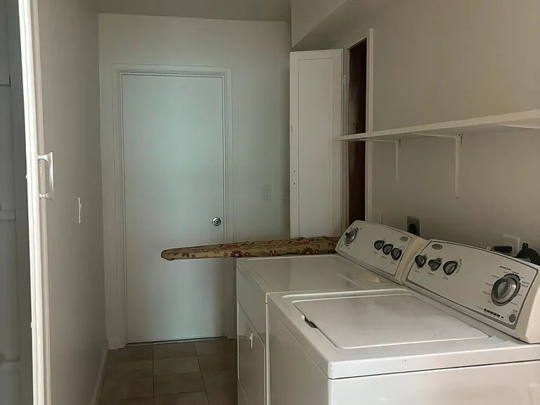 Laundry area and entry to Garage