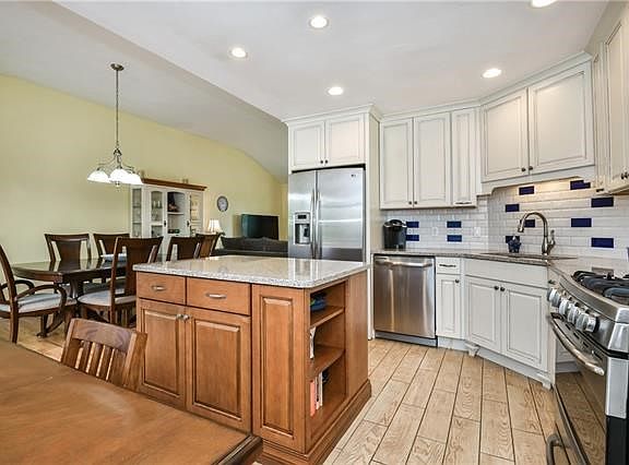 Detailed thought went into the re-design of this space gaining tons of storage and a  sunny open feel throughout