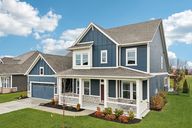 Craftsman Style Home with Board and Batten Siding and Stone Skirting