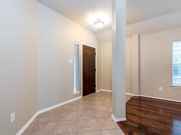 Upon entering the home, the natural light flows into the space! Ceramic tile flooring creates a traffic pattern that is so easy to maintain!