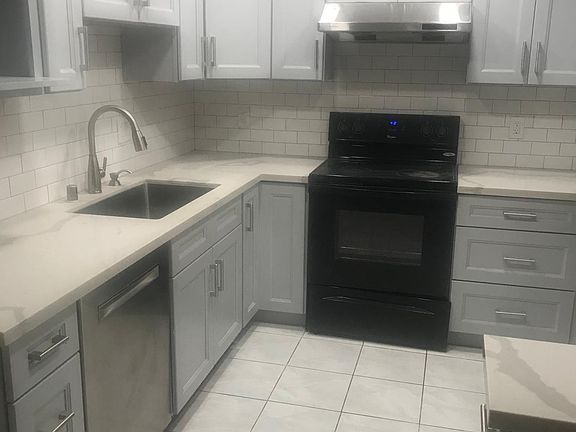 New kitchen, dishwasher, and refrigerator