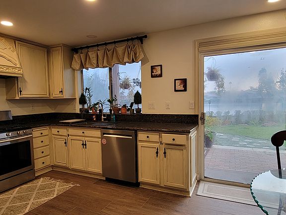 kitchen overlooks backyard garden and lake