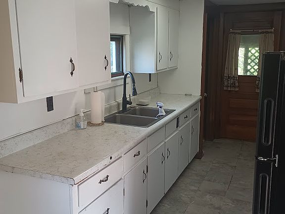 Galley Kitchen with toms of cabinets