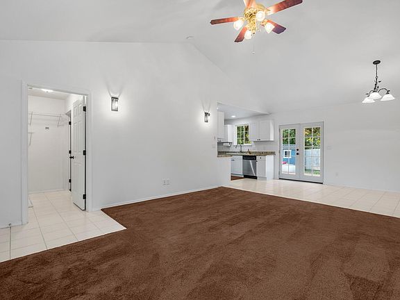 Main living area, laundry to the left, Kitchen and dining area to the right