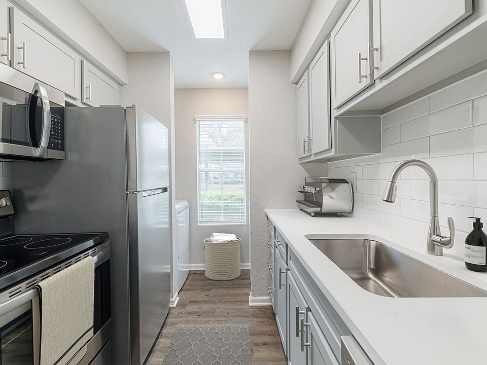Kitchen with quartz countertops and stainless steel appliances