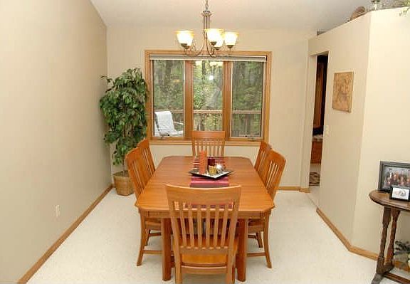 Formal dining room with private views of wooded backyard