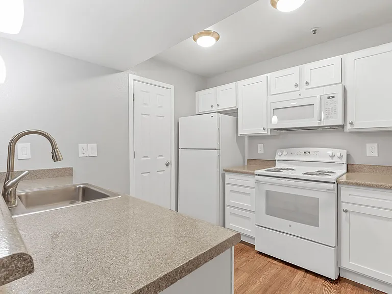 A Kitchen at The Buttes Apartment Homes in Loveland, CO