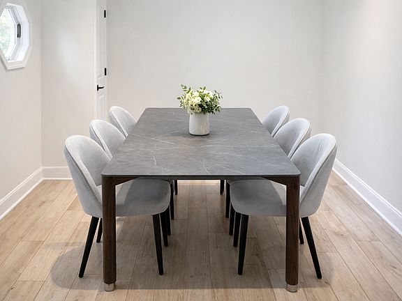 Formal dinning room area with 8 seat table