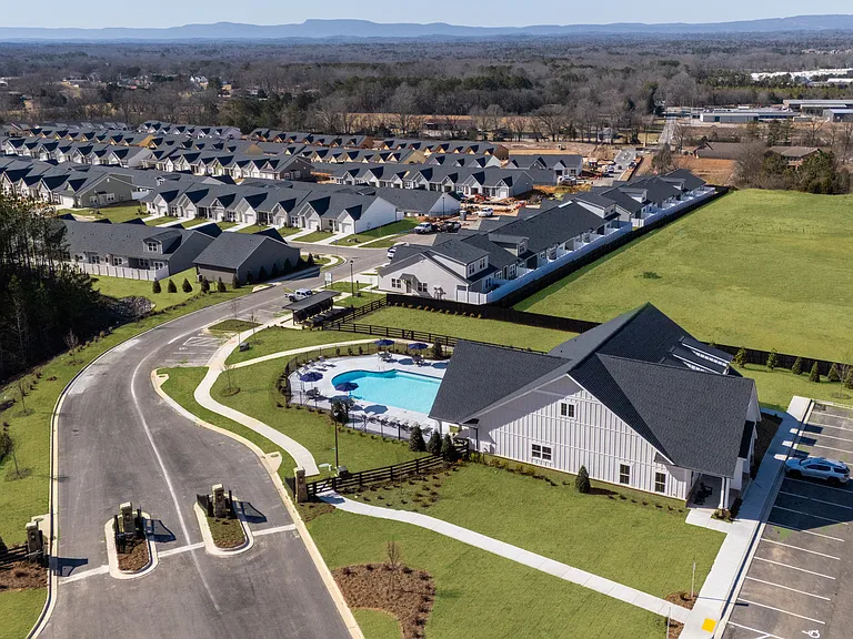 Aerial shot of the pool and back of the clubhouse.