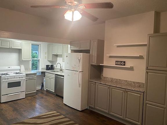 open concept kitchen and dining more counter cabinet and shelving 
lots of storage