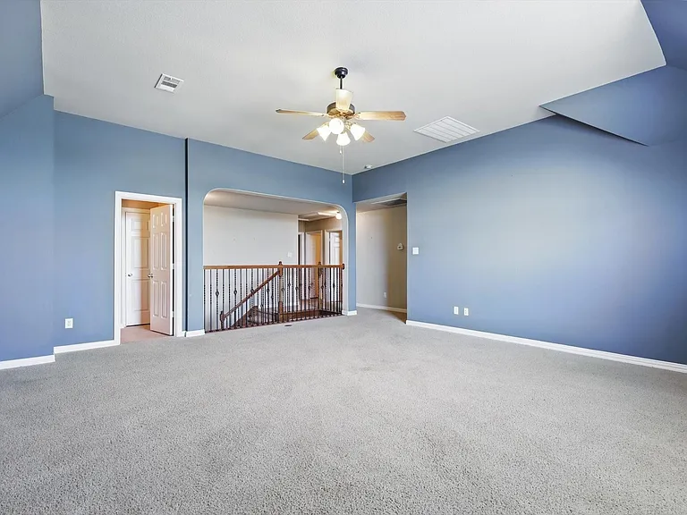 Reverse upstairs game or extended family room with rod iron railings, and entrance just to left into a full bath!