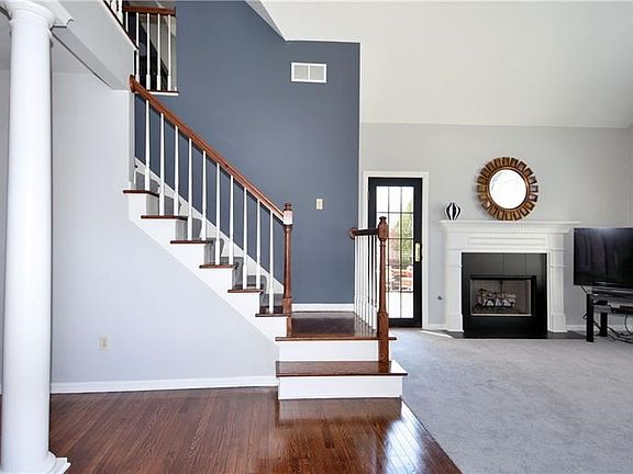 Beautiful hardwood graces the floors in the entry way and kitchen.