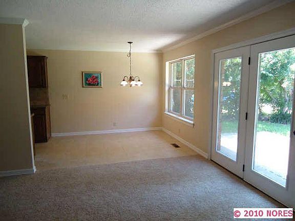 Living room and dining area. Living room has vinyl plan tile now