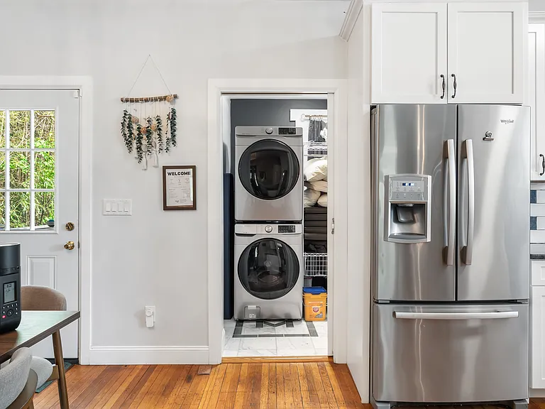 Kitchen with view to laundry room and half bath