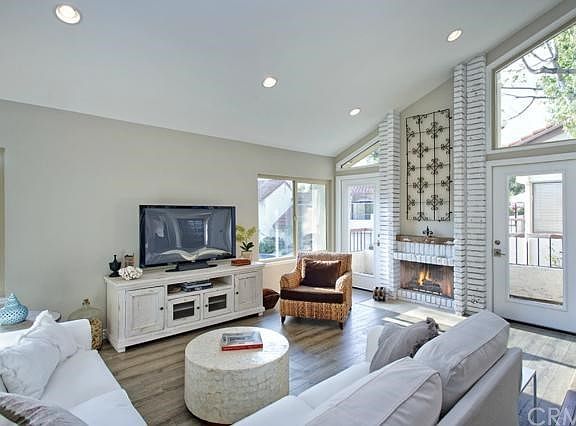 Recessed lighting & French doors leading to a balcony