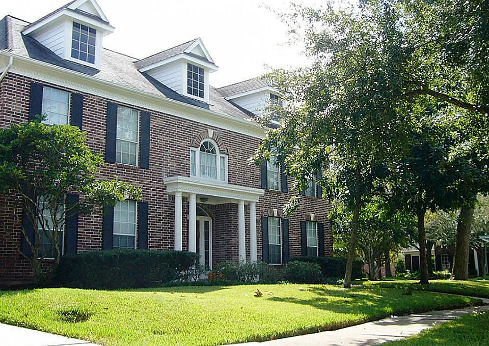 SIDE VIEW OF THE FRONT OF THIS GORGEOUS NEWMARK :"WATERFORD" FLOOR PLAN. 4154 SF OF ELEGANT FAMILY LIVING! ROOF AND SIDING RECENTLY REPLACED.